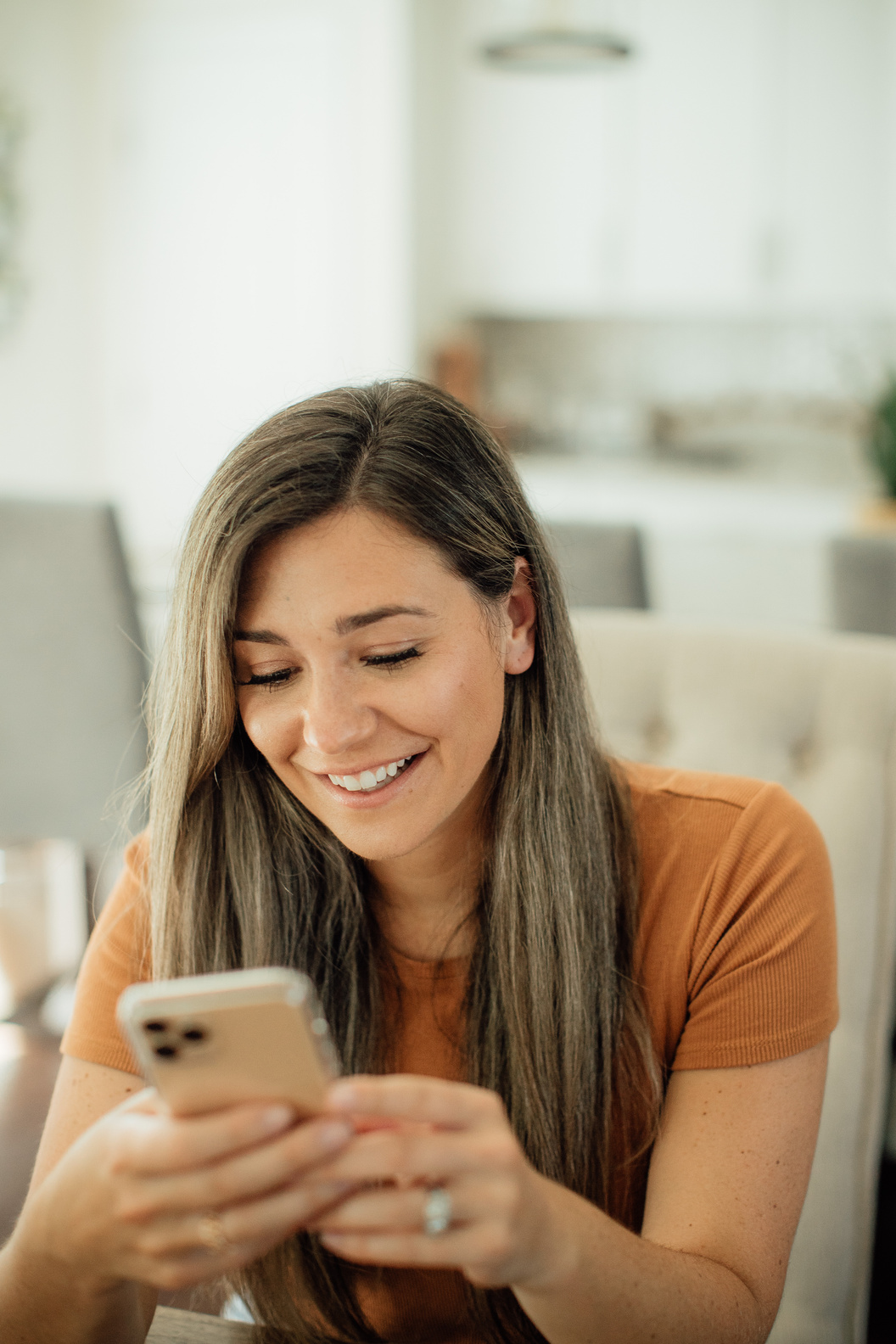 Happy Woman using Mobile Phone